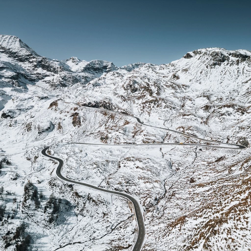 The Bormio side of the pass, with its wider, faster sweep of hairpins.